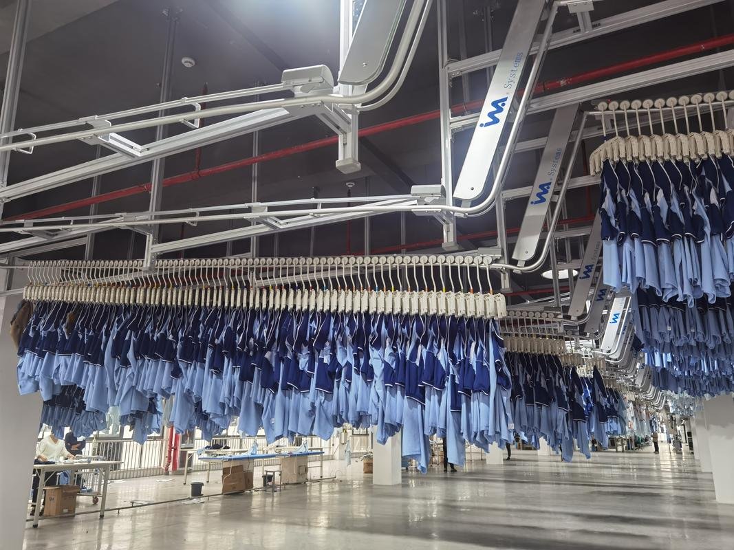 Finished garments moving through an automated hanging conveyor